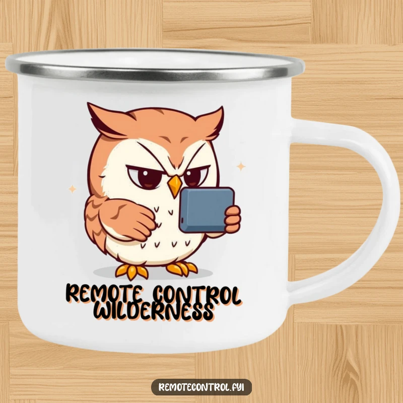 Funny owl camping mug depicting a determined owl intensely focused on a remote control, a humorous outdoor accessory.