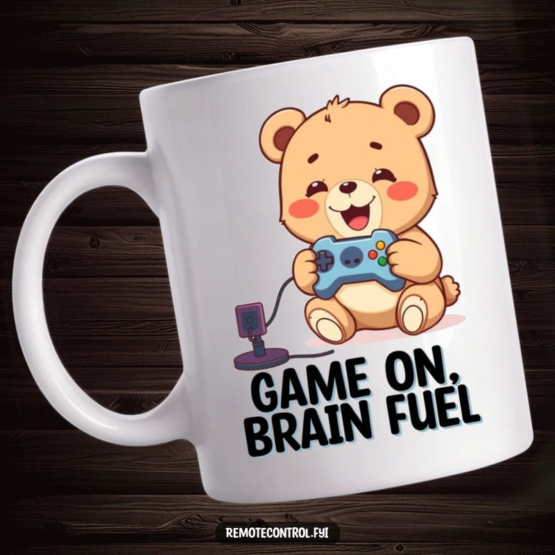 Funny bear cub playing video games with a remote, looking delighted and focused on the screen, perfect for gamer mugs.