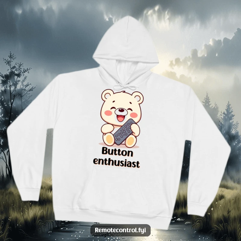 Funny Kawaii Bear Hoodie showing a bear grinning widely while holding a remote control with many buttons, signifying control.