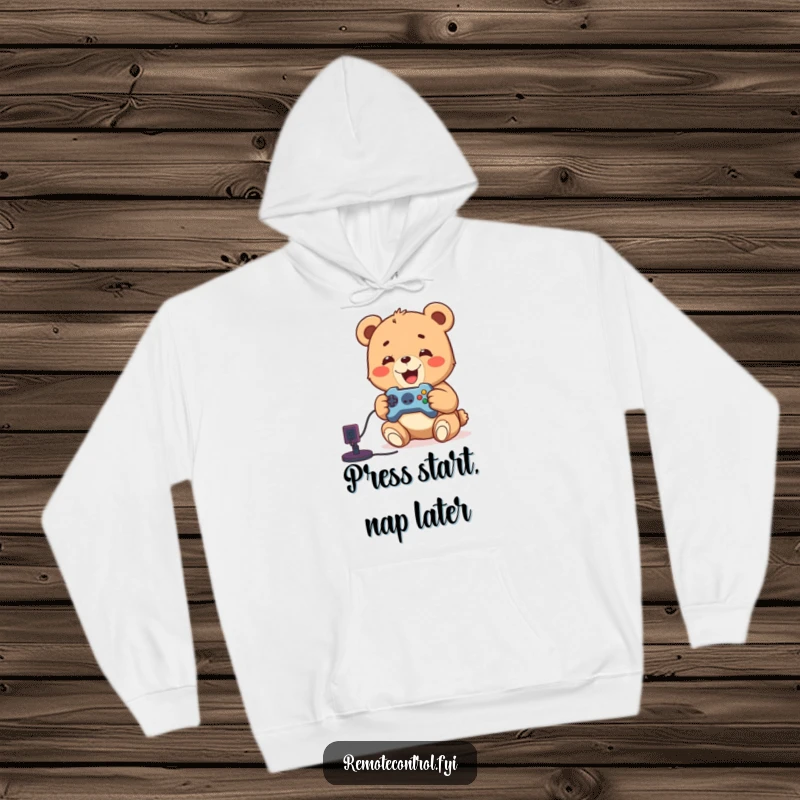 Funny hoodie showcasing a delighted bear cub focused on playing video games, holding a remote, perfect for cozy gamers.