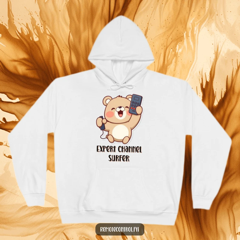 Funny hoodie with a delighted bear character holding a remote control upside down, looking content. Ultimate cozy and humorous wear.