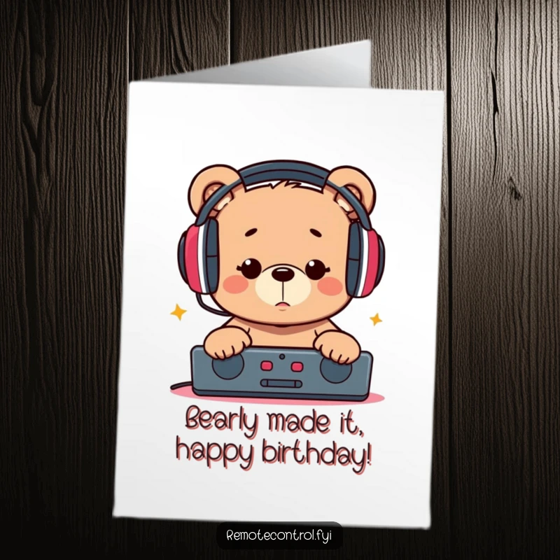 Funny free printable birthday card of a bear wearing big headphones, intensely focused on a remote, ready to party.