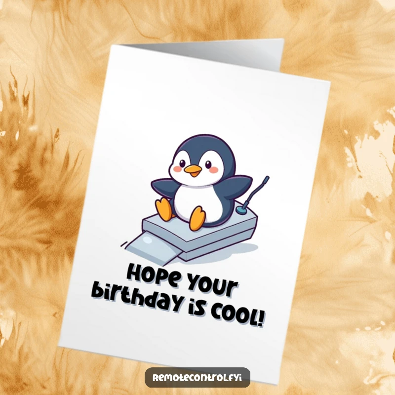 Funny Free Printable Penguin Birthday Card: Penguin sliding down a remote control like a ramp, having fun.