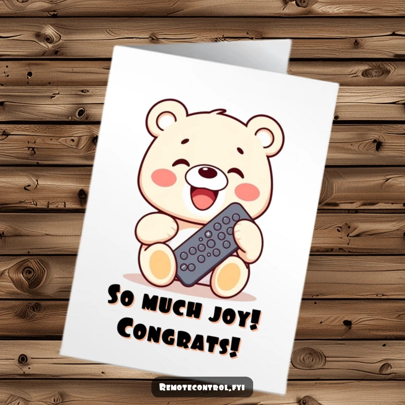 Funny Free Printable congratulations card featuring a kawaii bear grinning widely, holding a remote packed with buttons, celebrating a grand success.