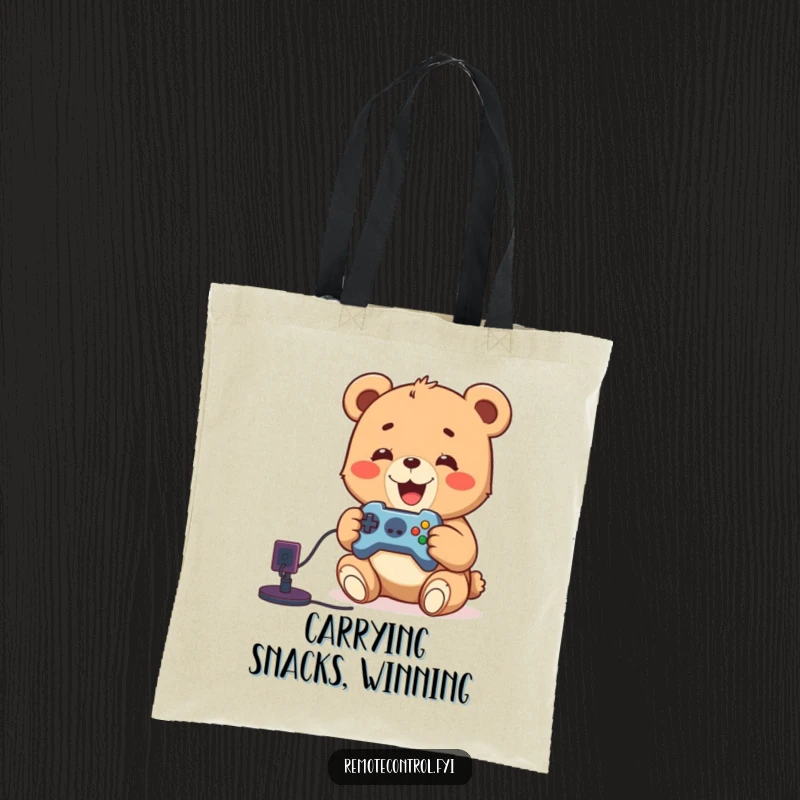 Funny tote bag featuring a delighted bear cub holding a remote, ready to play video games, showcasing gamer style.