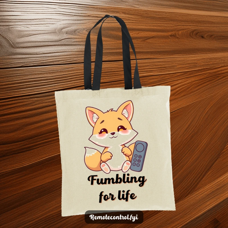 Funny giggling fox with wide, surprised eyes, desperately trying to use multiple remote controls, printed on a tote bag.