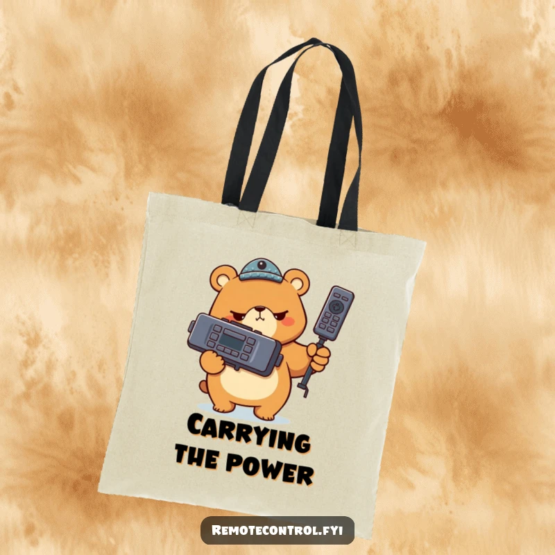 Funny bear character holding a giant TV remote with a serious look on a tote bag, highlighting a humorous and focused approach to control.